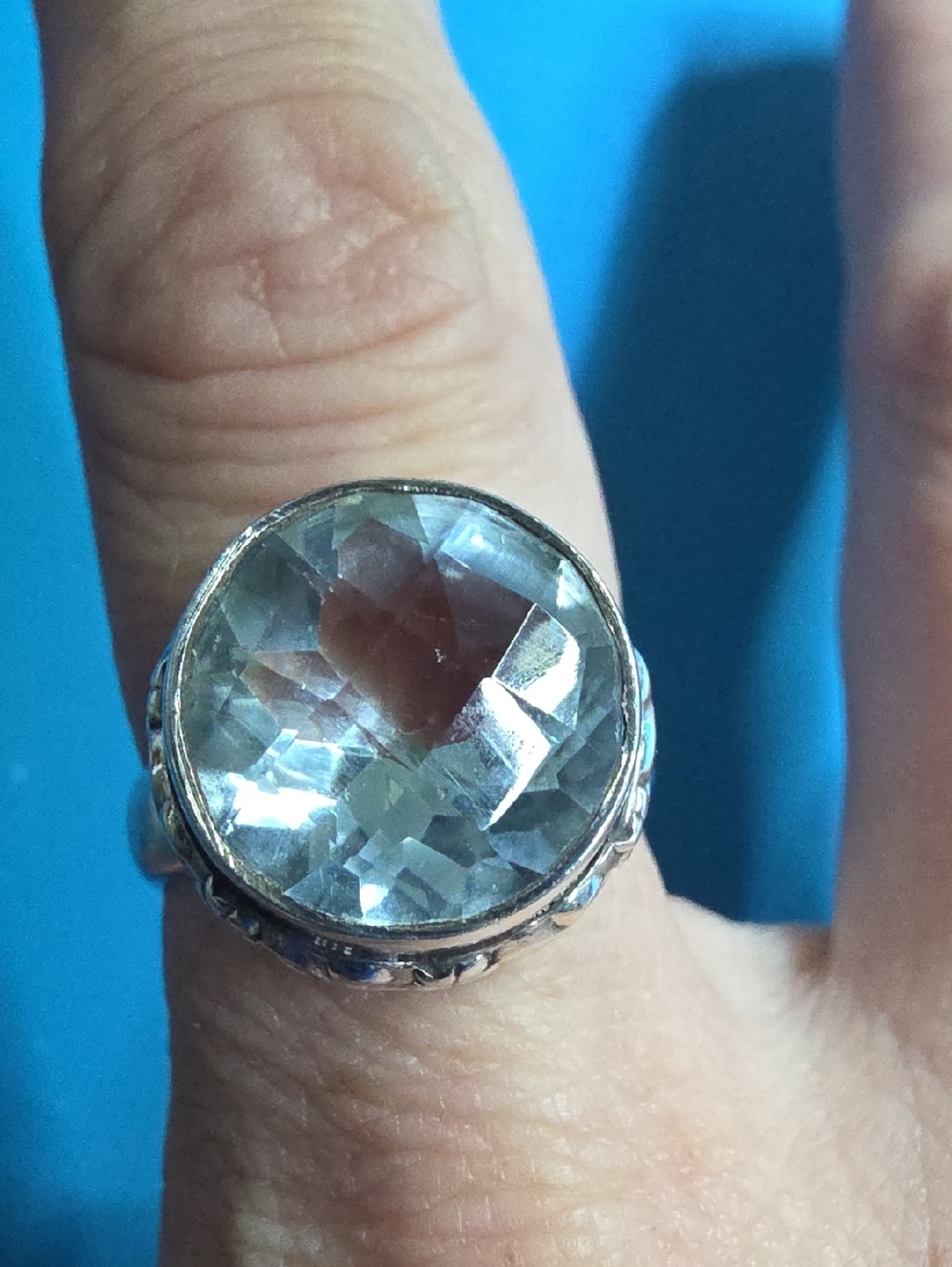 Vintage Aquamarine—bezel-set in an ornate sterling silver band.